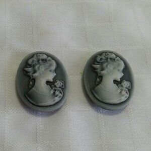 Two handmade magnets with a classic cameo style